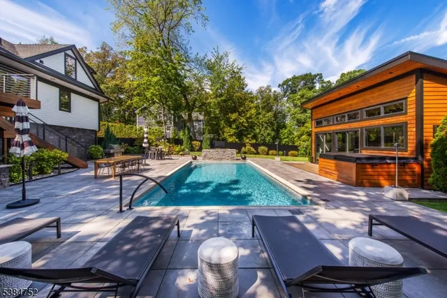 a view of a house with backyard