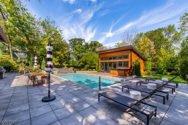 a view of a backyard with sitting area
