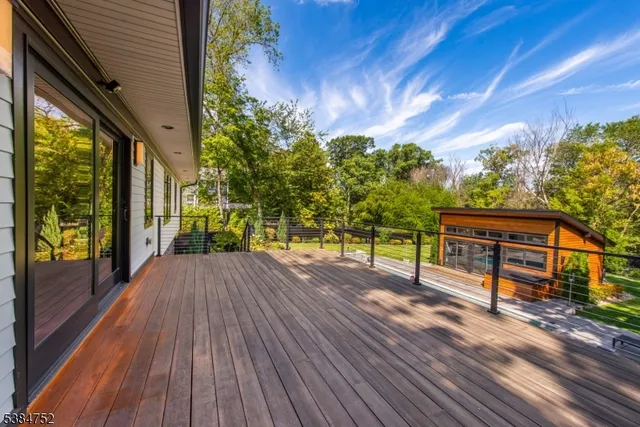 a view of a house with a yard patio and fire pit