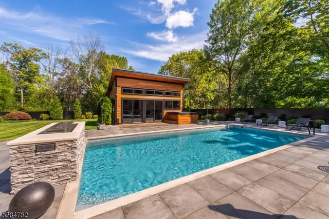 a view of a house with a yard porch and sitting area