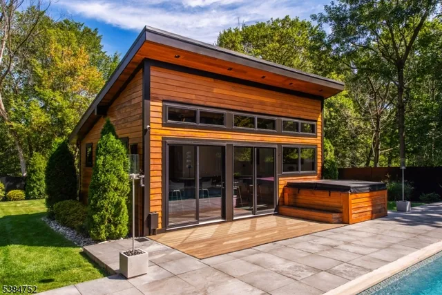 a backyard of a house with yard and outdoor seating