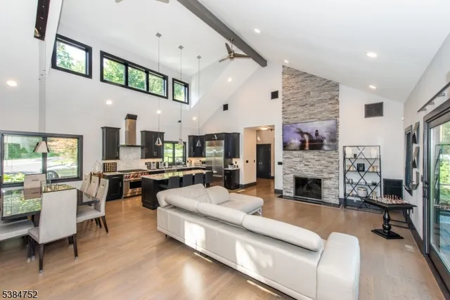 a living room with furniture fireplace and flat screen tv