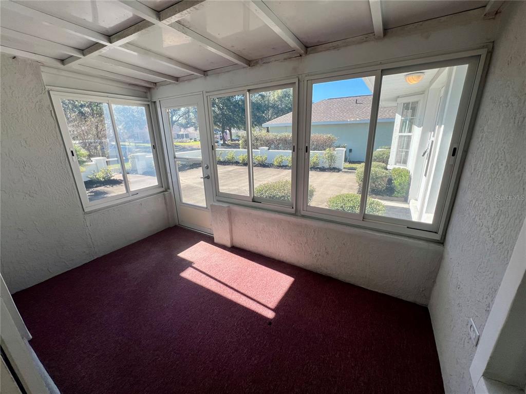 7205 Southwest 115th Place Ocala, FL 34476 - Photo 11 of 24 a view of an empty room with a window