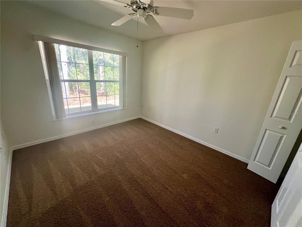 7205 Southwest 115th Place Ocala, FL 34476 - Photo 13 of 24 an empty room with a window