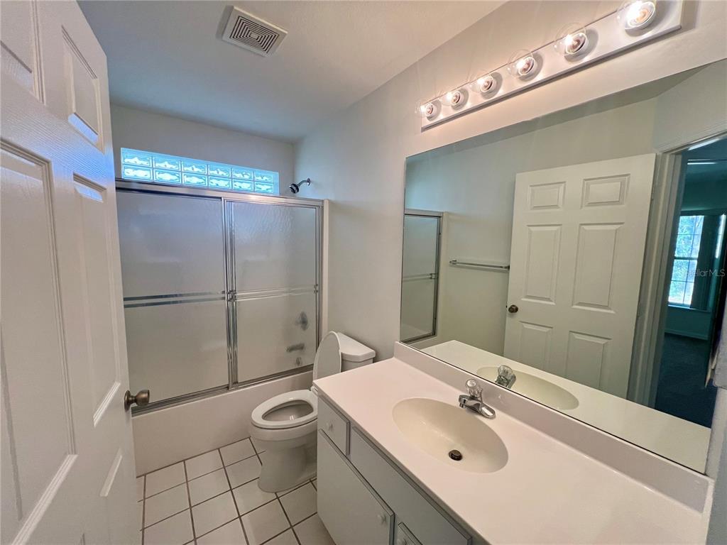 7205 Southwest 115th Place Ocala, FL 34476 - Photo 14 of 24 a bathroom with a sink toilet and shower