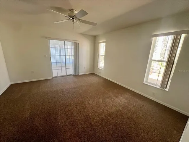 a spacious bathroom with a double vanity sink mirror and shower
