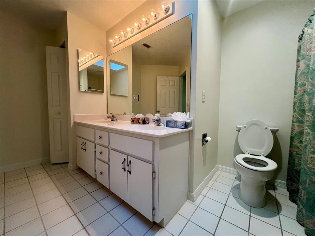 7205 Southwest 115th Place Ocala, FL 34476 - Photo 19 of 24 a bathroom with a sink toilet and mirror
