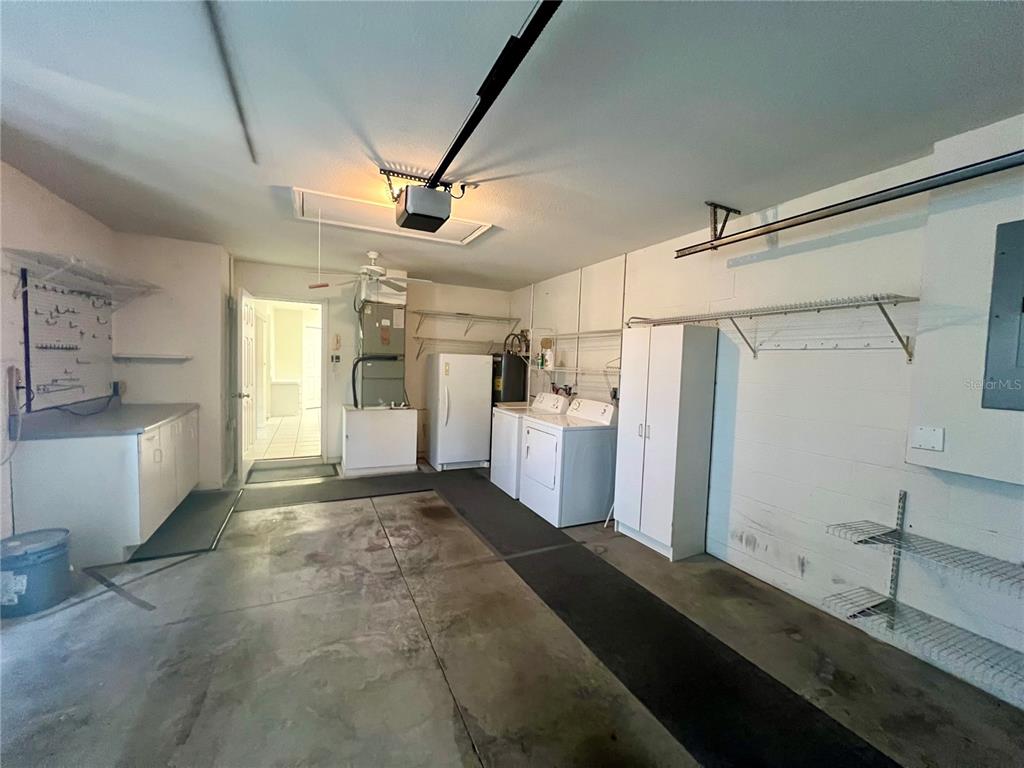 7205 Southwest 115th Place Ocala, FL 34476 - Photo 22 of 24 a view of a kitchen with refrigerator and windows