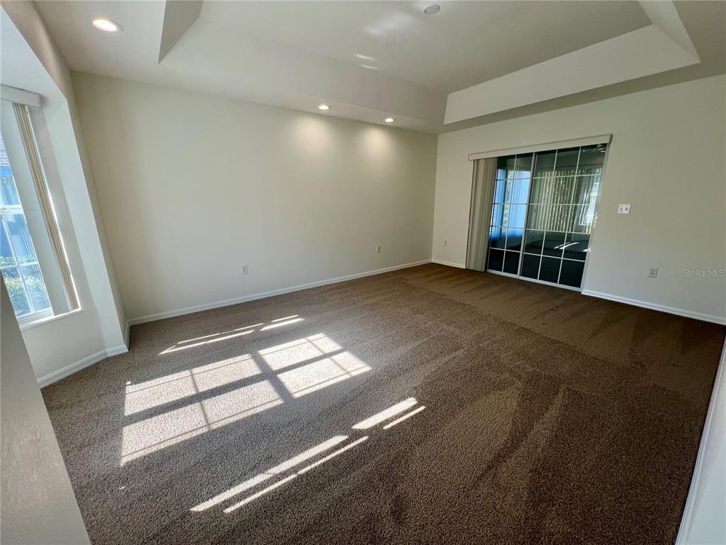 7205 Southwest 115th Place Ocala, FL 34476 - Photo 5 of 24 an empty room with windows