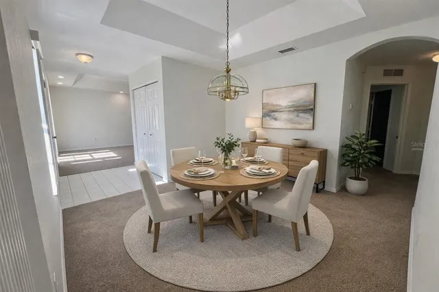 a dining room with furniture and window