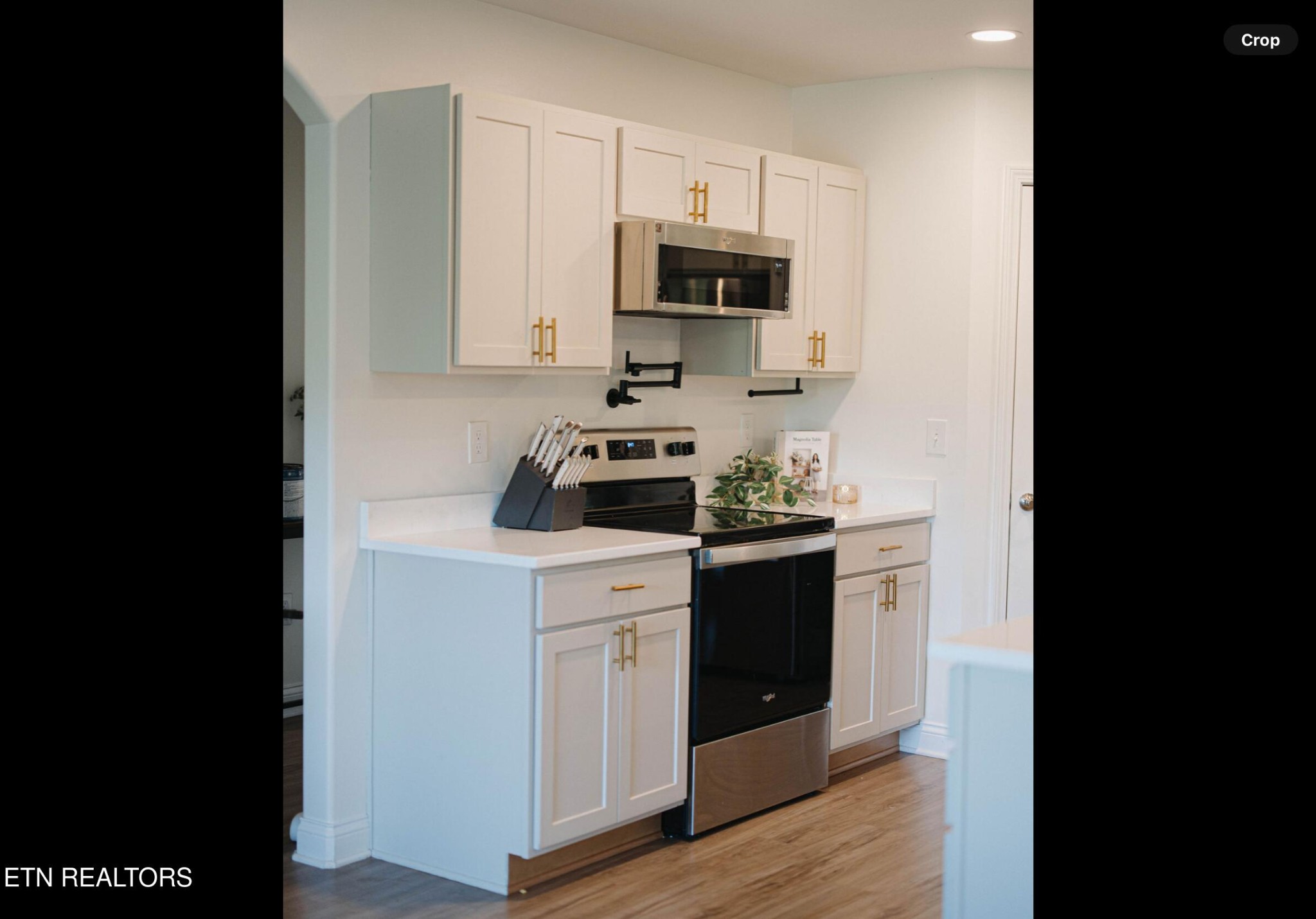 7921 Bud Hawkins Road Corryton, TN 37721 - Photo 8 of 24 a kitchen with a sink cabinets and appliances