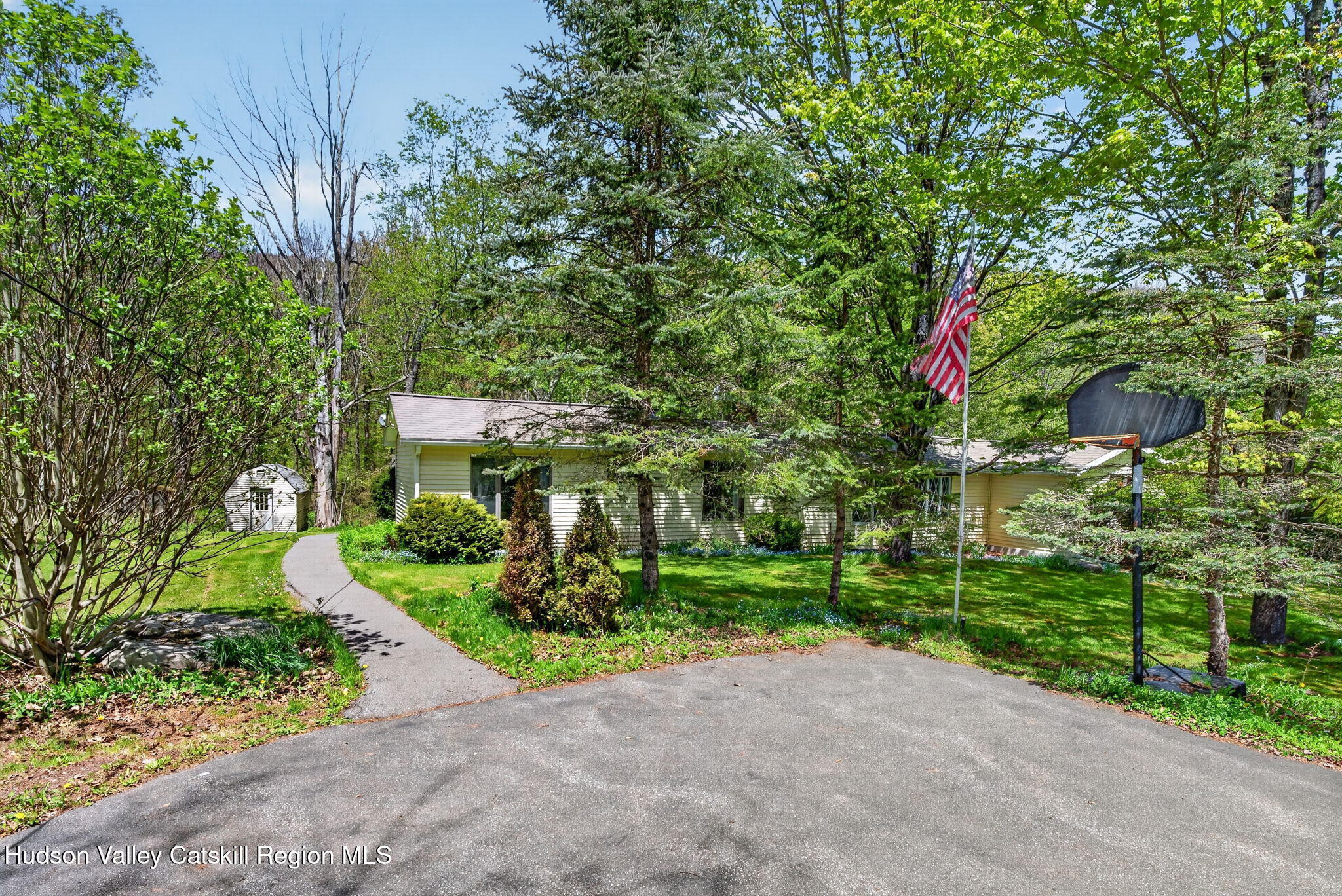 689 Old Road Windham, NY 12496 - Photo 35 of 42 a front view of a house with a yard and plant