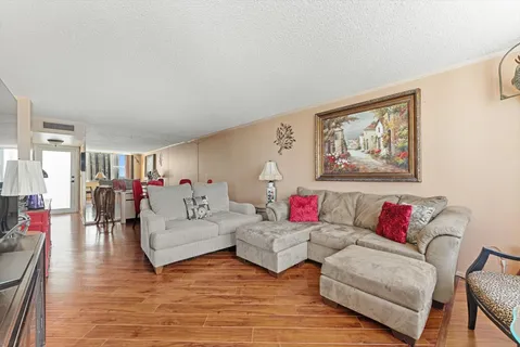 a living room with furniture and white walls