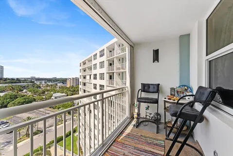 a view of a balcony with chairs