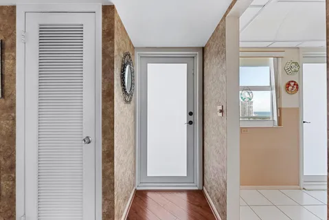 a view of front door with wooden floor