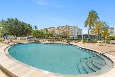 a view of a swimming pool with a terrace