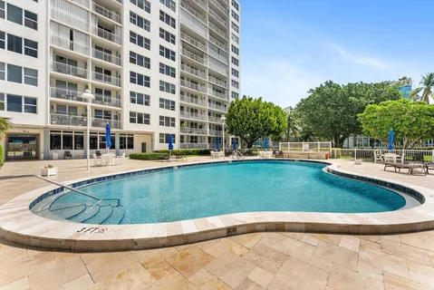 a view of swimming pool with outdoor seating