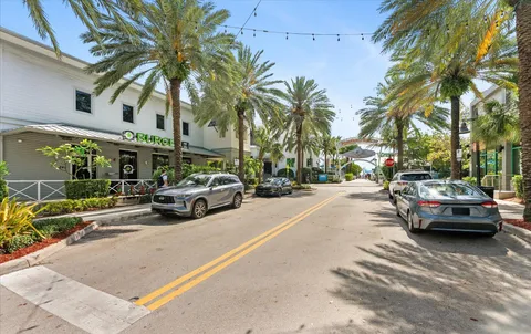 a view of street with parked cars