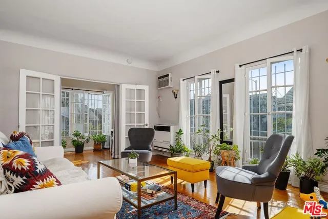 a living room with furniture and a table
