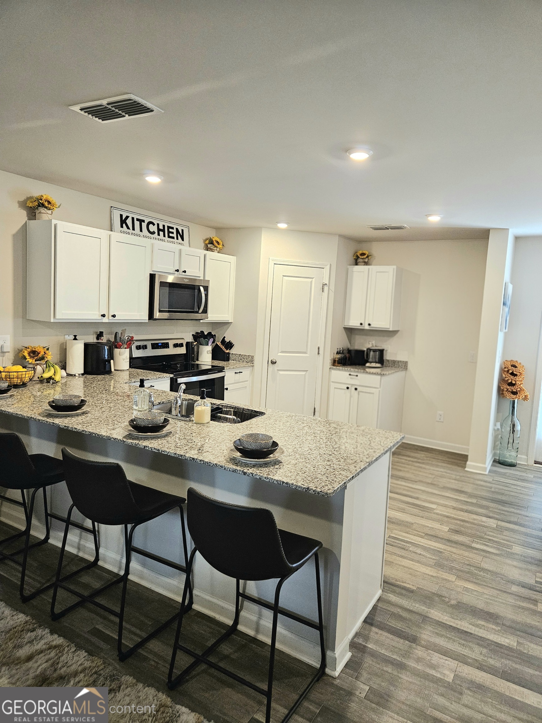 138 Catalpa Road Milner, GA 30257 - Photo 9 of 29 The fridge has been removed from this picture with AI