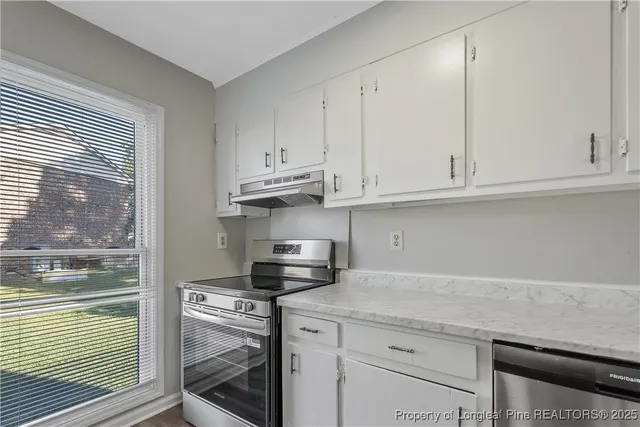 a view of a room that has a window