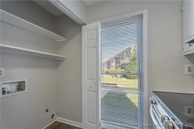 a view of an empty room and wooden floor