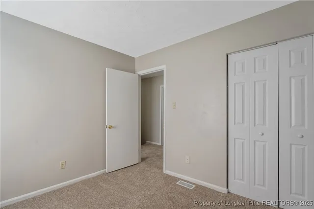 a view of a wooden door with a bench
