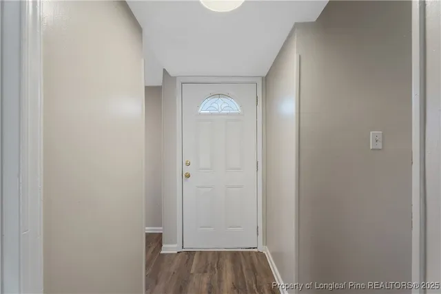 a view of room with wooden floor