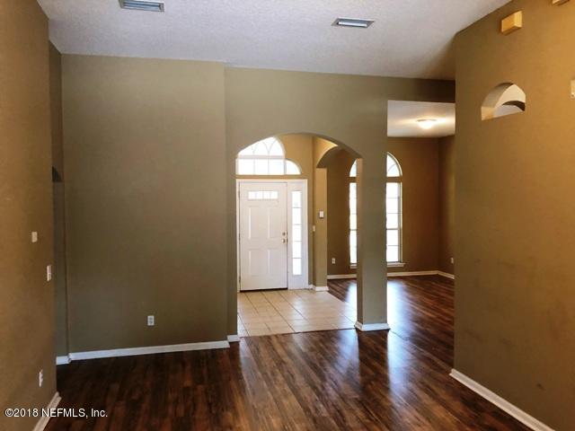 12067 Spring Ridge Drive Jacksonville, FL 32258 - Photo 3 of 36 a view of gallery with wooden floor