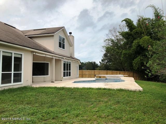 12067 Spring Ridge Drive Jacksonville, FL 32258 - Photo 36 of 36 a view of a house with pool and sitting area