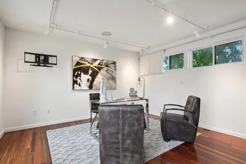 a view of workspace with furniture and window