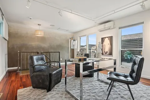 a living room with furniture and a table