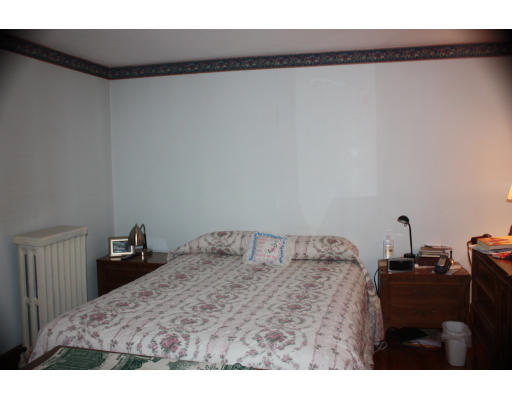 47 Concord Road Billerica, MA 01821 - Photo 17 of 21 a bedroom with a bed and a table