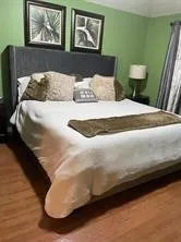 a bedroom with a bed and window