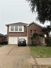 a car parked in front of a house