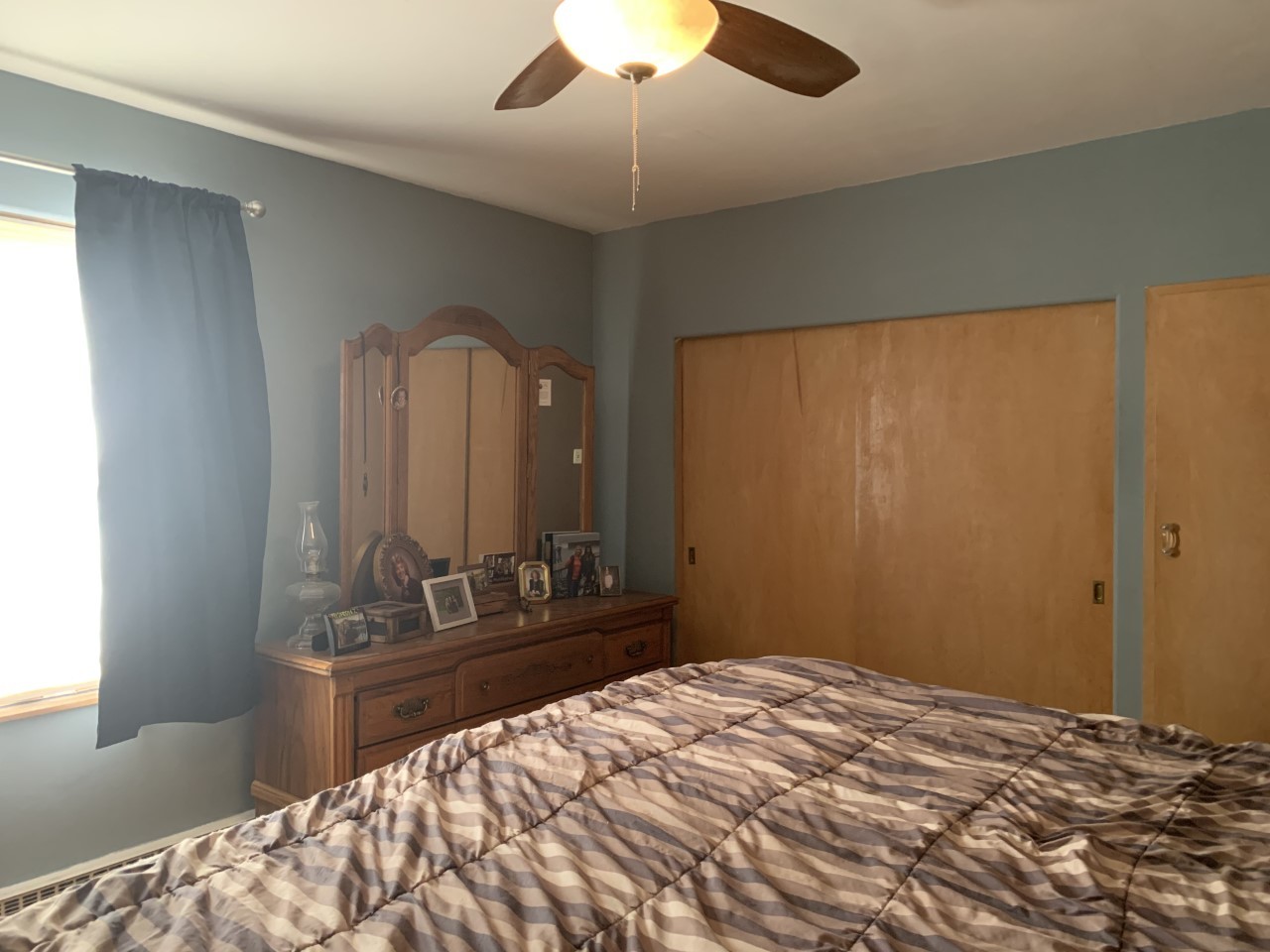306 Maple Street Cedar Point, IL 61316 - Photo 23 of 43 a bedroom with a bed and a chandelier