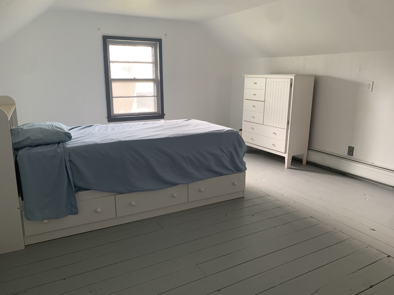 306 Maple Street Cedar Point, IL 61316 - Photo 29 of 43 a living room with a bed and a window