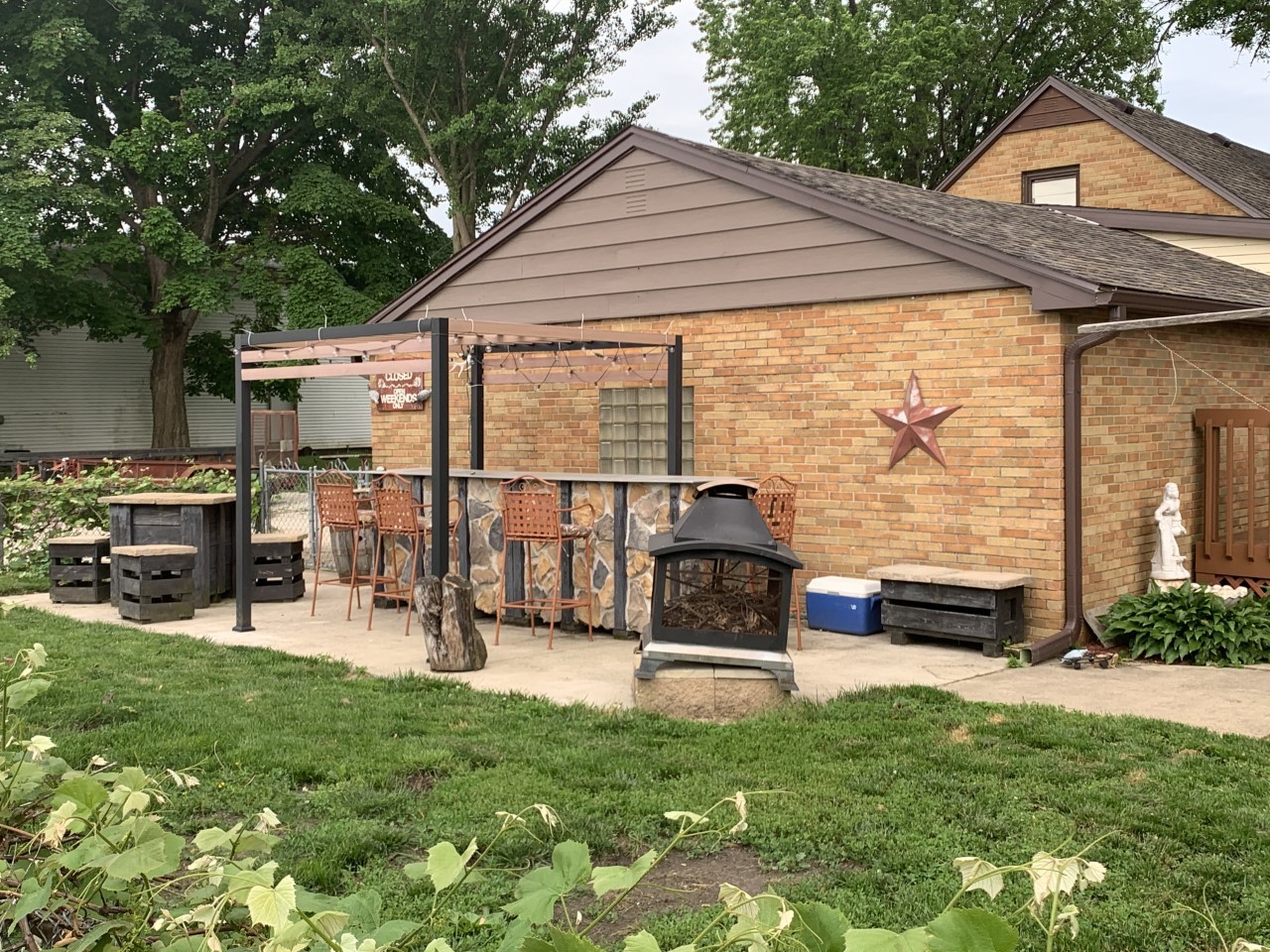 306 Maple Street Cedar Point, IL 61316 - Photo 37 of 43 a view of backyard with a table and chairs under an umbrella