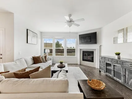 a living room with furniture and a fireplace