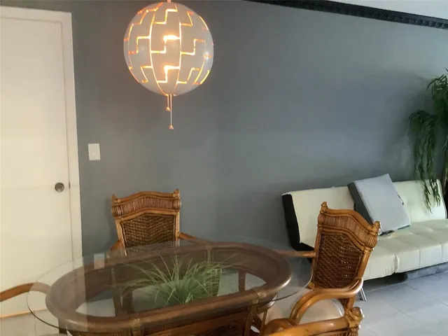 a room with a sink and a mirror