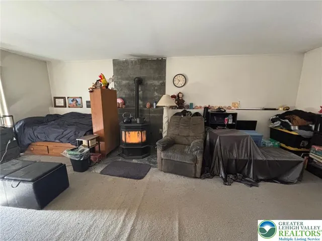 a bedroom with furniture and a gym equipment