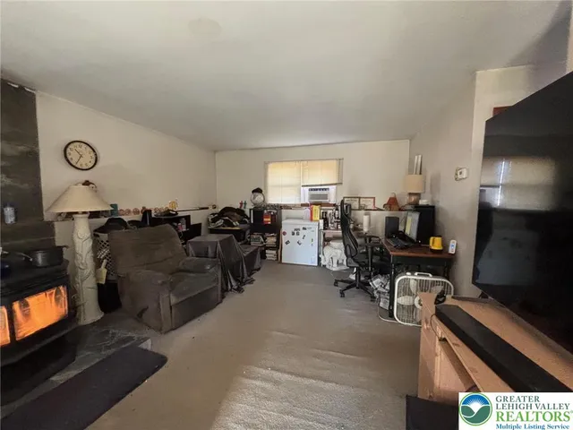 a living room with lots of furniture and a flat screen tv