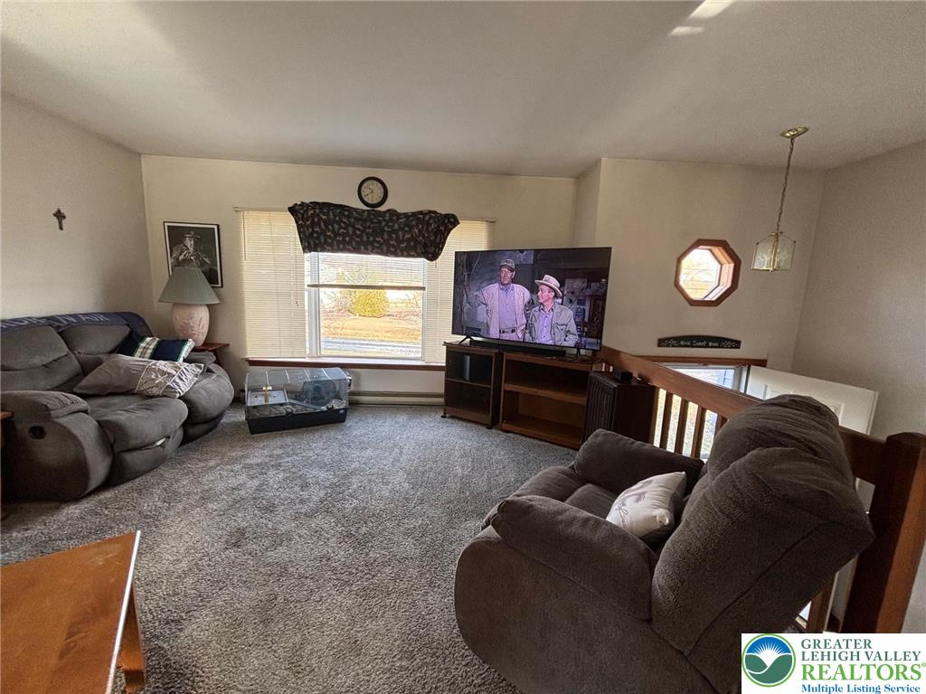 2547 Williams Road Bath, PA 18014 - Photo 7 of 18 a living room with furniture a window and a flat screen tv
