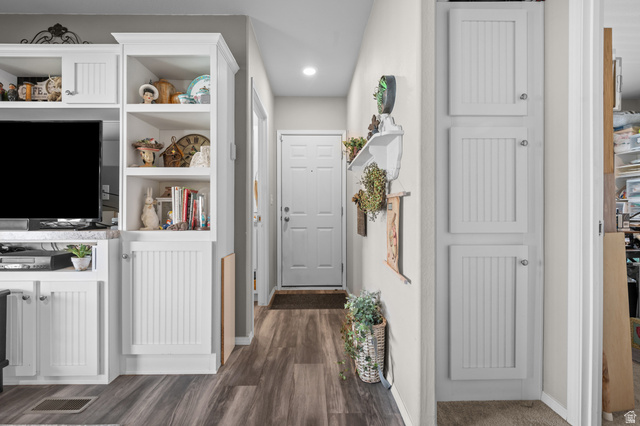 150 West 7500th South, Unit 13 Midvale, UT 84047 - Photo 3 of 32 Wood-finish flooring throughout, complemented by a white paneled entry door and recessed ceiling lighting
