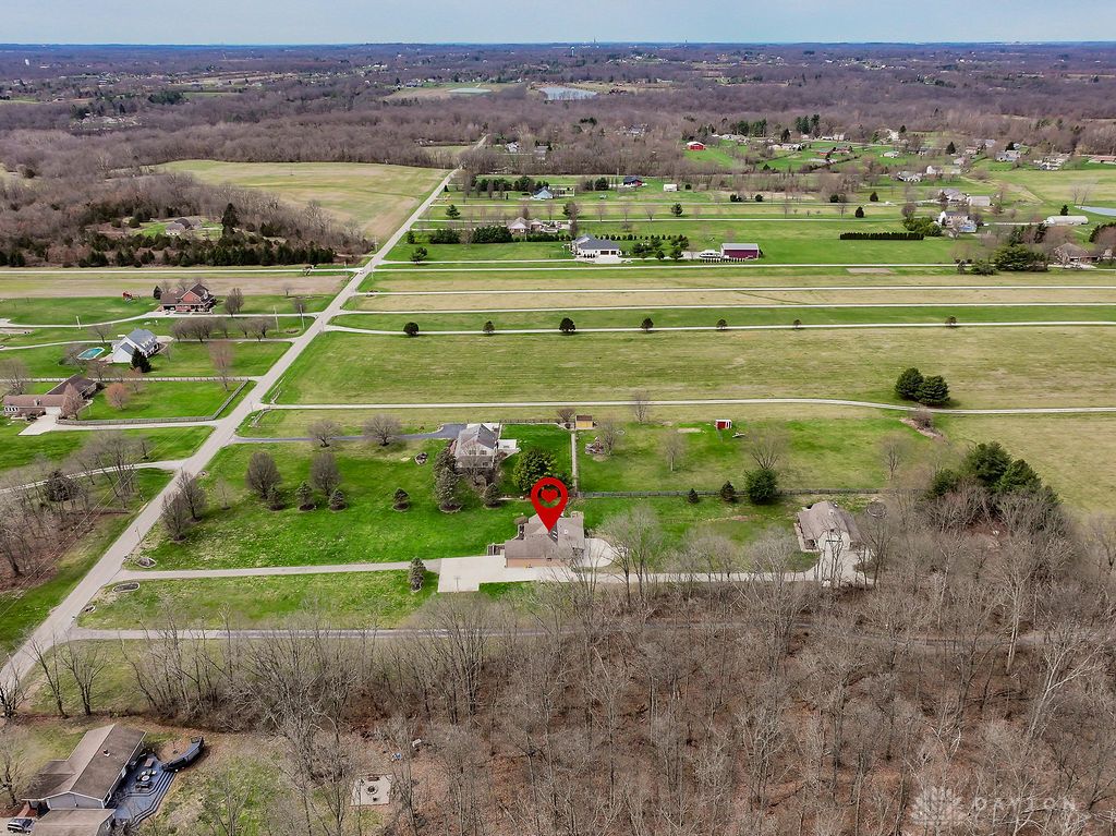 7400 Cook-Jones Road Waynesville, OH 45068 - Photo 11 of 72 An expansive aerial perspective highlights the property amidst verdant fields and scattered homes.