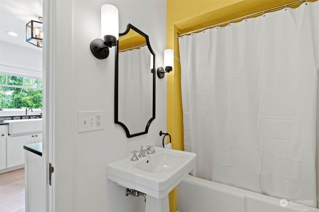 a bathroom with a sink and a mirror