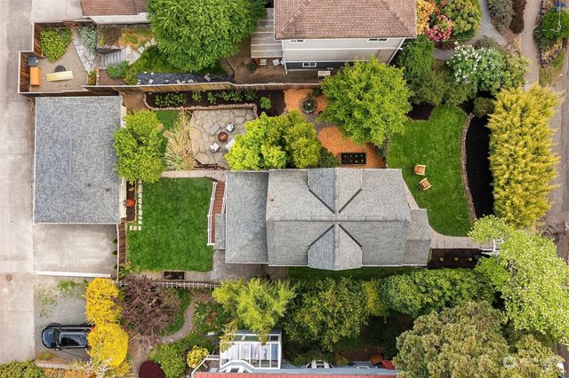an aerial view of a house with a yard and garden