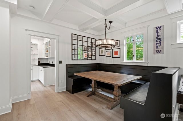 a room with pool table and windows