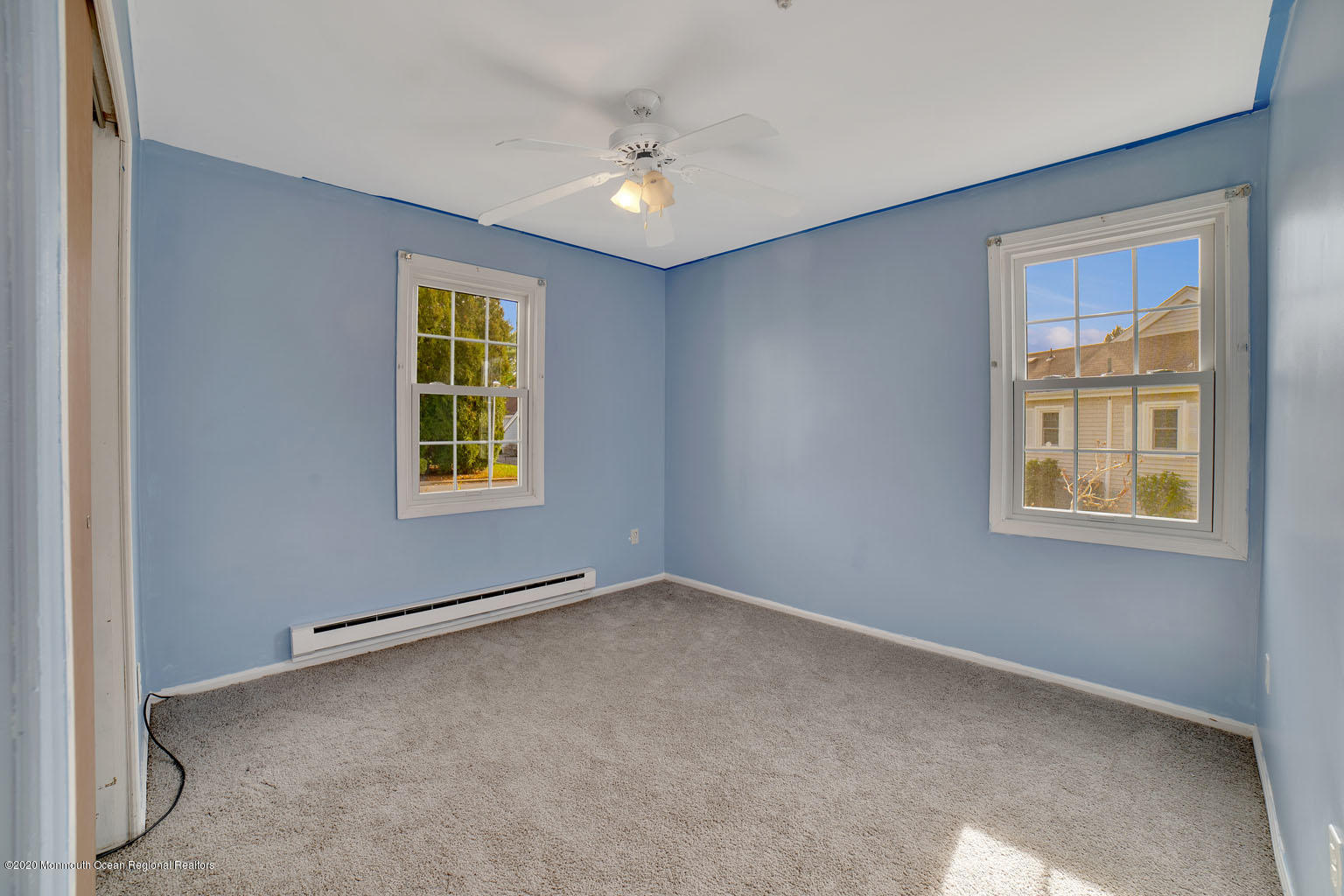 136 Rigi Strasse, Unit 1000 Freehold, NJ 07728 - Photo 11 of 25 an empty room with windows