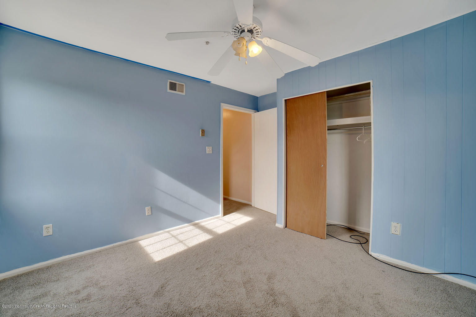 136 Rigi Strasse, Unit 1000 Freehold, NJ 07728 - Photo 12 of 25 an empty room with closet and a ceiling fan